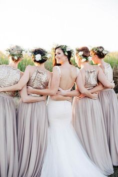 the bridesmaids are all wearing different dresses