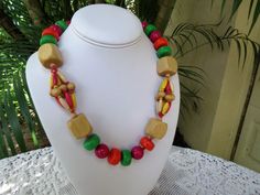 "This strand of Painted Wood Beads is in excellent condition. The beads measure a nice chunky 3/4\" in diameter. This old kitschy necklace measures 21\" long. It is perfect for summer because it is a really light weight. Perfect for beach or resort glam. Have fun with this one. Please view the photos as part of the description and feel free to ask a question. Thank you for your interest." Painted Wood Beads, Wooden Bead Necklace, Glass Jewelry Box, Wooden Bead Necklaces, Beautiful Perfume Bottle, Beautiful Perfume, Fort Myers, Old Wood, Pink Glass