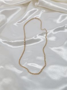 Our 18k Gold Filled Rope Chain Necklace is the perfect layering piece to accentuate any style. This lightweight rope chain pairs beautifully with other chain necklaces or pendants--We love it with our Anabella Necklace. This essential necklace is a must-have for every fashion lover! Details 18k Gold Filled 18in 20in, 22in in Length 2.5mm width model wearing 20in Tarnish-resistant, water-resistant, and safe for sensitive skin Rope Chain Necklace For Everyday, Everyday Rope Chain Necklace, Long Figaro Chain Necklace As Gift, Figaro Chain Long Necklace As Gift, Gift Rope Chain Necklace With Figaro Link, Elegant Rope Chain Link Necklace As Gift, Gold Rope Chain Necklace With Figaro Style, Gold Link Rope Chain Necklace For Gift, Gold Link Rope Chain Necklace Perfect For Gift