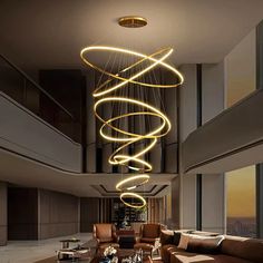 a living room filled with furniture and a spiral light chandelier hanging from the ceiling