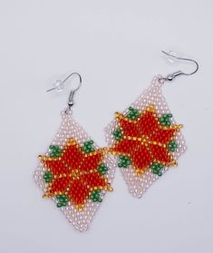 "\"Christmas Star\" - Beaded rhombus-shaped earrings (5 x 3.5 cm) Hand-beaded with small, glass beads. ~Hand made ~Unique design ~Hypoallergenic and nickel-free A perfect Christmas and New Year gift for your mother, wife, sister, daughter, or friend Each pair of earrings is individually made and has a unique design." White Faceted Beads Beaded Earrings Gift, Handmade Jewelry For Christmas Celebration, White Faceted Beaded Earrings As A Gift, Beaded Jewelry For Christmas Celebrations, Beaded Jewelry Christmas Gift, Beaded Jewelry For Christmas Gift, Handmade Elegant Beaded Earrings For Christmas, Christmas Beaded Jewelry Gift, Colorful Beads Christmas Earrings Gift