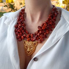 Raw red jasper crystal modern beaded necklace with leopard pendant. Chunky statement natural gemstone beaded necklace for women. Large orange gold handmade necklace with big bead and gemstone. Big bold bohemian bright necklace in gold color are suitable for an casual look, evening look and for a holiday. These necklace will be a good Christmas, anniversary, wedding or birthday gift for women, mom, wife, girlfriend, sister or daughter. Women's necklace with natural stone. It emphasizes the beauty White Statement Necklace, Handmade Multi-strand Amber Jewelry, Handmade Amber Multi-strand Jewelry, Chunky Layered Necklaces, Gold Handmade Necklace, Red Jasper Crystal, Red Jasper Necklace, Bold Bohemian, Baroque Jewelry