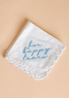 a white napkin with blue writing on it that says,'now happy holidays '