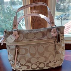 Coach Pop Mtl Sig Sat Glam Handbag Never Used, In Original Packaging. Exterior Color: Cream Light Khaki Interior Color: Light Pink Material: Canvas Original Box: Yes Measurements: 16"X12"X3.5" Cosmetic Condition: New With Retail Tag Attatched. Khaki Interior, Large Leather Purse, Coach Tote Bags, Large Handbag, Pocket Handbag, Brown Leather Bag, Coach Shoulder Bag, Large Handbags, Pretty Bags