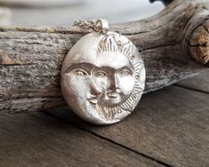 This celestial sun and moon pendant necklace is made by using the ancient lost wax technique and it is hand forged. It comes in a sterling silver chain of your choice or a wax cord and the pendant is 23gr solid sterling silver made in great detail. A unique, ethereal piece of jewelry that will add character to any look and is ideal as a gift to yourself or to someone special. The total length of the chain is 460mm, please contact me if you would like me to custom made the length of your chain. A Celestial Sun And Moon Sterling Silver Necklace, Celestial Sterling Silver Necklace With Sun Design, Silver Celestial Necklace With Sun Design, Sterling Silver Necklace With Sun Design, Hand Forged Sterling Silver Celestial Necklace, Flat Engagement Rings, Necklace Sun And Moon, Sun And Moon Pendant, Red Crystal Ring