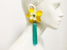 Get ahead of spring, and buy this flower statement earrings for your colorful outfits. These long statement tassel earrings is the perfect accessory for a great spring outfit. Bold and delicacy go together in this flower and tassel earrings. If your wedding is this season, I can create for you the earrings with the ideal color to match with bridesmaids dresses. IMPORTANT INFORMATION Process time -2-5 business days For further information about the shipping to your country, please consult the Sho Flower Statement Earrings, Big Statement Rings, Colorful Outfits, Round Dangle Earrings, African Earrings, Bold Necklace, Golden Necklace, Long Tassel Earrings, Flower Ornaments