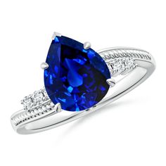 a blue sapphire and diamond ring on a white background