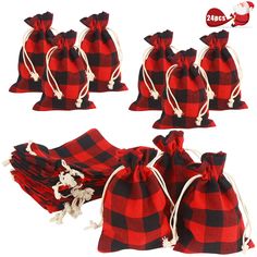 six red and black buffalo plaid bags with white string draws on each bag, all lined up in different directions