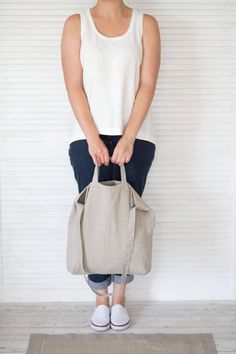 "This natural linen bag is roomy enough for your day's carry, shopping, market, school, college, university, beach, sport, travel, yoga. This shoulder bag is made of softened Baltic natural linen. This linen tote bag is constructed with two different sizes handles. The bag can be or not constructed with a big zippered pocket inside (YKK zipper). ❤ AVAILABLE COLORS: * natural * black ❤ SIZE: * width at top 43 cm (17\") * length 40 cm (16\") ❤ CARE: Hand or machine wash (gentle cycle) in 30-degree Eco-friendly Rectangular Shoulder Bag For Everyday Use, Eco-friendly Hobo Bag Tote For Everyday Use, Eco-friendly Everyday Hobo Tote Bag, Eco-friendly Hobo Bag For Everyday, Eco-friendly Everyday Shoulder Bag, Practical Beige Tote Bag, Eco-friendly Everyday Double Handle Bucket Bag, Eco-friendly Tote Shoulder Bag For Everyday, Eco-friendly Hobo Bag With Adjustable Strap