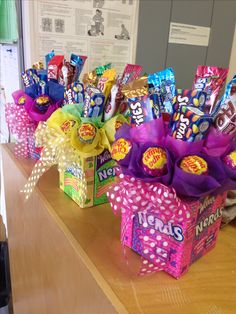 candy bouquets are lined up on the counter