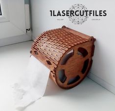 a toilet paper holder made out of wood