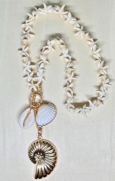 shell jewelry, shell necklace, shell jewelry, coastal necklace, coastal jewelry, vacation necklace, vacation jewelry. 18 inch toggle, genuine shell pendant necklace.  All jewelry purchases come beautifully gift wrapped at no additional cost. Complementary thank you goodie with each purchase as a token of our appreciation 1. Avoid Chemicals: Remove jewelry before using household cleaners, perfumes, or lotions. 2. Proper Storage: Store in a soft pouch or lined jewelry box to prevent scratches and Beach Shell Necklace Made Of Mother Of Pearl, White Shell Charm Necklaces For The Beach, Ocean-inspired Shell Charm Necklace With Lobster Clasp, White Shell Charm Necklace Gift, White Shell Charm Necklaces, Vacation Shell Necklace With Mother Of Pearl, Mother Of Pearl Shell Necklace For Vacation, Vacation Mother Of Pearl Shell Necklace, Beach Jewelry With Shell-shaped Lobster Clasp