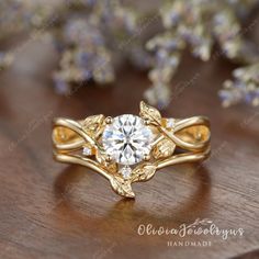 a gold ring with a diamond center surrounded by flowers