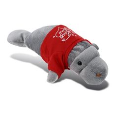 a stuffed hippo laying on its side wearing a red shirt