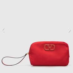 Valentino Garavani Large Cosmetic Case In Red Satin Exterior And Lining With Antique Gold-Tone Hardware. Made In Italy. Measures Approx 8.5w X 5.5h X 2.5d. Zip Around Top Closure With Leather Wrist Strap. Interior Slip Pocket. Metal And Acrylic Logo Detail At Front. Vent-Wy616. Uw2p0u67prv. Comes With Dust Bag And Authentication Cards Luxury Red Clutch With Removable Pouch, Elegant Red Travel Pouch, Luxury Red Pouch For Everyday Use, Luxury Red Clutch With Gold-tone Hardware, Red Evening Pouch, Luxury Red Formal Pouch, Red Rectangular Evening Pouch, Red Clutch Pouch For Evening, Acrylic Logo