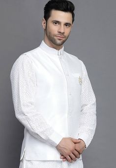 Art Silk Nehru Jacket in WhiteThis Readymade Sleeveless attire is Enhanced with Buttons. Crafted in Chinese Collar NeckDo note: Brooch and Kurta shown in the image is for presentation purposes only. Half to one inch may vary in measurement. (Slight variation in actual color vs. image is possible) Mens Kurta | Mens Kurta Pajama | Mens Sherwani | Mens Sherwani Sets | Traditional Menswear | Partywear Menswear | Indian Mens Dresses | Diwali Kurta | Kurta Pajama | Bollywood Menswear | Mens Nehru Jack Luxury Off-white Nehru Jacket For Men, White Sleeveless Formal Outerwear, White Nehru Jacket With Stand Collar For Formal Occasions, White Stand Collar Bandhgala For Wedding, White Bandhgala With Stand Collar For Wedding, White Nehru Jacket With Stand Collar For Festive Occasions, White Festive Nehru Jacket With Stand Collar, Festive White Nehru Jacket With Stand Collar, White Embroidered Sleeveless Nehru Jacket