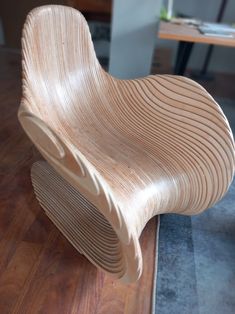 a wooden chair sitting on top of a hard wood floor