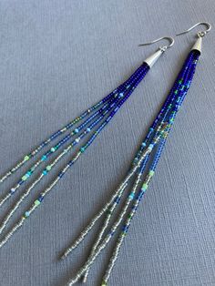 Silver and Blue Seed Beads 4 6 and 9 - Etsy Multi-strand Blue Spacer Beads, Blue Multi-strand Spacer Beads, Blue Bohemian Heishi Beads Jewelry, Bohemian Blue Beaded Earrings With Tiny Beads, Bohemian Blue Beaded Earrings For Festivals, Blue Beaded Heishi Beads Jewelry, Handmade Blue Heishi Beads Earrings, Blue Spacer Beads For Festivals, Blue Beaded Earrings With Colorful Beads As Gift