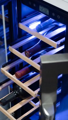 a wine rack with several bottles in it