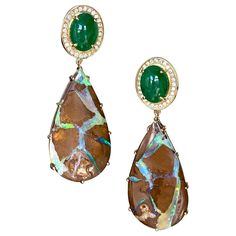 Drop dangle earrings of oval cabochon tsavorites surrounded by diamond pave, with pear shaped boulder opal drops, handcrafted in 18 karat yellow gold. These one-of-a-kind earrings of gorgeous tsavorites, boulder opals and diamonds reflect the natural beauty of Mother Earth's colors and intrinsic beauty. The vivid green blue veins of the opals are so vibrant in contrast to the brown background opal color, and they truly sparkle in the light! The beautiful green hues of the tsavorites also bring out the vivid greens in the opals. These luxurious earrings bring a touch of natural elegant style to every look! Blue Veins, Koroit Opal, Pink Opal Earrings, Dope Jewelry Accessories, Opal Drop Earrings, Sapphire And Diamond Earrings, Sparkly Jewelry, Luxury Earrings, Snake Earrings