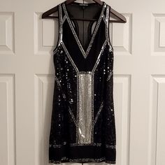 Brand: Express Size: Women's Xs Color: Black And Silver Material: 100% Polyester Lining: 100% Polyester Care: Hand Wash Cold Fun Party/Cocktail Dress! Brand New Without Tags. Msrp: $108.00 Sheer Chiffon Fabric With Black And Silver Sequins. This Is Fully Lined Inside. Sleeveless Arms With A V-Neck Front Give This A Sexy Piece A Modern Style And Look. Silver Sleeveless Sequin Cocktail Dress, Silver Sleeveless Sequin Dress For Night Out, Silver Sleeveless Mini Dress For Night Out, Fitted Sleeveless Silver Sequin Dress, Silver Sleeveless Sequin Dress For Date Night, Silver Sleeveless Dress For Date Night, Fur Purse, Mini Short, Express Dresses