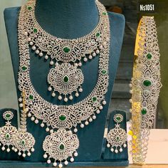 an elaborate necklace and bracelet set on display