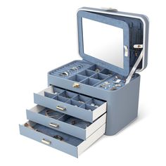 an open blue jewelry box with three drawers and two mirrors on the top one is empty