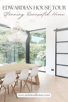 an image of a dining room with white chairs