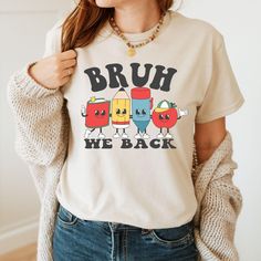 Get ready for the school season with our "Bruh We Back Shirt." This cute and trendy back-to-school shirt is perfect for students and teachers alike, adding a fun twist to your school wardrobe. Show your school spirit and embrace the new academic year in style! How to Order,  -All scroll pictures -Select the Size and Color of the Product from the drop-down menus - Select Quantity - Add your table and place your order - You need to repeat each step for each shirt Our main priority here is customer Preppy Cotton T-shirt With Letter Print, Preppy Short Sleeve School T-shirt, Preppy Short Sleeve T-shirt For School, End Of School Year Long Sleeve T-shirt, Casual Relaxed Fit Shirt For School, Cute Pre-shrunk Shirt For Back To School, Long Sleeve T-shirt For End Of School Year, Collegiate Graphic Print Tops For School, Graphic Print College Style Tops For School