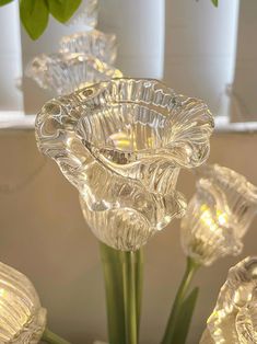 a glass vase with some flowers in it