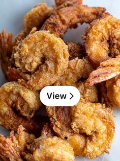 fried shrimp is shown with the word view above it to describe what type of food they are