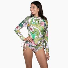 Stylish and protective, the Berry Jane Ruched Side Long Sleeve Swimsuit Rash Guard Set is perfect for active watersports. Fully lined with a built-in bra and removable pads. This beautiful Hawaiian floral print rash guard was made for days spent in the sun and at the beach. UPF 50 protection helps shield your skin from harmful rays, while the ruched sides provide a flattering fit. Whether you're hitting the beach or pool, this rash guard swimsuit is a must-have for your next adventure. Sale item Hawaiian Floral Print, Rashguard Swimsuit, Long Sleeve Swimsuit, Swimsuit Set, Upf 50, Tropical Floral, Swim Bottoms, Rash Guard, Women Long Sleeve