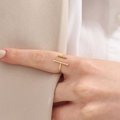 Introducing our Plain Cuff Ring, a minimalist masterpiece. Crafted in your choice of 14k solid gold, this unique open T-bar ring features an adjustable double bar design. Its simplicity and asymmetry make it an elegant choice for women who appreciate contemporary jewelry.  The ring can be made with yellow, rose, or white gold, please choose your size from the dropdown menu options above. 𝐑𝐢𝐧𝐠 𝐃𝐞𝐭𝐚𝐢𝐥𝐬 ❥ Solid gold, available in 10, 14 & 18 karats. ❥ Gold Color Options: White Gold, Yell Modern Yellow Gold Initial Ring With Open Band, Modern 14k Gold Open Midi Rings, Modern 14k Gold Midi Rings, Modern Initial Ring With Simple Open Design, Modern Initial Ring With Open Design, Modern Open Initial Ring With Simple Design, Minimalist Yellow Gold Initial Ring With Open Band, Modern Initial Open Ring With Simple Design, Modern Initial Ring With Simple Design