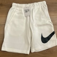 New With Tags Men’s Size Extra Small, White Nike Sweat Shorts. White Cotton Athletic Shorts With Relaxed Fit, White Sportswear Athletic Shorts For Loungewear, White Relaxed Fit Cotton Athletic Shorts, White Sportswear Shorts For Leisure, Sporty White Leisure Shorts, White Relaxed Fit Athletic Shorts, Nike White Streetwear Shorts, Nike Casual White Bottoms, White Sportswear Athletic Shorts With Pockets