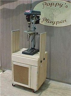 there is a radio on top of a small stand in front of a sign that says papapy's playpen