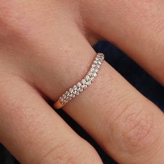 a woman's hand with a diamond ring on it