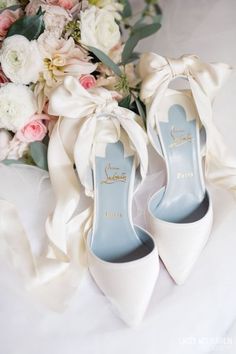 wedding shoes and bouquet on the bed with text that reads, click here for more