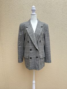 "For sale is a gorgeous vintage PENDLETON Classic double breasted blazer in glen plaid houndstooth pattern in black, white and pink colors. Made in USA. 100% Virgin Wool.  This fully lined blazer features padded shoulders, notched lapels, three pairs button down closure, imitation side pockets with flaps.  Absolutely gorgeous piece in a very good vintage condition. Marked size 12.  For a proper fit please see the measurements below. Measurements (flat): Shoulder to shoulder: 17\" Armpit to armpit: 22\" Sleeve length: 23,5\" Waist: 41\" Hips: 46\" Shoulder to hem: 29\"" Classic Double-breasted Houndstooth Blazer, Classic Double-breasted Plaid Blazer, Double-breasted Plaid Blazer With Double Button Closure, Plaid Double-breasted Blazer For Business Casual, Plaid Double-breasted Office Blazer, Plaid Double-breasted Blazer For Office, Classic Plaid Blazer For Work, Double-breasted Plaid Office Blazer, Double-breasted Plaid Blazer For Office