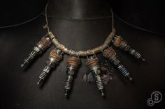 Angel of ignition - Post-apocalyptic necklace - Chumbucket necklace - Spark plugs - Shells - Junk jewelry by StrojePostApo on Etsy https://www.etsy.com/listing/617035779/angel-of-ignition-post-apocalyptic Wasteland Jewelry, Apocalyptic Jewelry, Mad Max Fashion, Wasteland Fashion, Apocalyptic Wasteland, Post Apocalyptic Clothing, Wasteland Warrior, Fallout Cosplay, Post Apocalyptic Costume