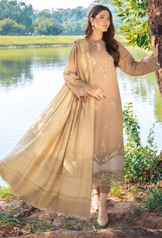 Brand: HumdumCollection: Onora by Humdum Unstitched Winter CollectionFabric: Khaddar DESIGN DETAILS: Shirt Fabric Khaddar Embroidered Shirt Front 1.25 Mtrs Plain Dyed back 1.25 Mtrs Embroidered Sleeves 0.75 Mtrs Jacquard Shawl 2.5 Mtrs Khaddar Dyed Trouser 2.5 Mtrs DISCLAIMER:* Lining, Laces, and Tassels are not included in unstitched variants.* Embellishment items in stitched outfits are subject to market availability.* The actual colors of the outfit may vary from the colors being displayed on your device. CARE INSTRUCTIONS: Extra Fabric Has Been Used For Shoot Original Color May Vary Slightly From The Picture Dry Clean Recommended Iron The Clothes At Moderate Temperature Do Not Use Bleach, Or Stain Removing Chemicals Damp Fabric Should Not Be Exposed To Sunlight Onora by Humdum Unstitch Formal Semi-stitched Jamawar Dupatta, Designer Gold Lawn Suit With Naqshi, Gold Lawn Suit With Naqshi In Traditional Drape, Unstitched Raw Silk Lawn Suit With Zari Work, Semi-stitched Gold Jamawar Lawn Suit, Elegant Unstitched Jamawar Dupatta, Unstitched Raw Silk Lawn Suit For Eid, Semi-stitched Naqshi Raw Silk Lawn Suit, Elegant Unstitched Jamawar Salwar Kameez