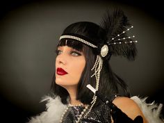 Spectacular female headdress with white decorative pearls and three large ostrich feathers. Perfect for Great Gatsby Party, Burlesque, 1920s Retro. Elastic Width - 0.78 '' (Stretchable). Pen heights up to 7.87 inches. The size of this headdress is universal for adult person. It sits soft and comfortable on the head and you can dance and move a long time. 100% designed and handmade by our designers ( SETA Design studio in Kyiv).  It will be securely packed in a box. Feel free to contact us if you Flapper Evening Headpiece With Feathers, Black Flapper Headpieces For Vintage Events, Flapper Style Feather Headpiece For Vintage Events, Gatsby Style Feather Headpieces For Vintage Events, Flapper Style Feathered Headpieces For Vintage Events, Flapper Style Headband For Costume Party, Adjustable Flapper Headpiece With Feathers, Gatsby Style Headpiece For Carnival Costume Party, Vintage Feather Headpieces For Vintage Events