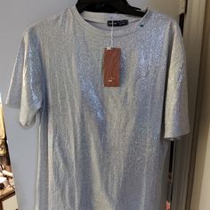 Nwt Shein Women's Sxy Short Sleeve Mock Neck Glitter Tee Cg2 Silver Size Large Women's T-Shirt, Fitted, Smooth And Comfortable. Matching: Our Women's Tops Can Be Paired With Short Skirts, Pants, And Shorts. Occasion: Suitable For Daily, Travel, Home, Vacation, Party, Outdoor, And Club Wear Trendy Shimmer Tops For Summer, Trendy Shimmer Summer Tops, Trendy Shiny Tops For Night Out, Trendy Shiny Top For Night Out, Stretch Glitter Tops For Party Season, Shimmer Stretch Tops For Night Out, Trendy Metallic Tops For Party Season, Trendy Shiny Tops For Party Season, Trendy Shiny Top For Party Season