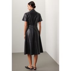 Black faux leather (100% Polyurethane) Midi dress. V-Neckline. Short Sleeves. Back zipper closure. 40" shoulder to hemline. Imported. Chic Leather Workwear Dress, Leather Midi Dress For Work, Spring Leather Workwear Dress, Spring Leather Dress For Work, Sleek Leather Workwear Dress, Sleek Leather Dresses For Workwear, Fitted A-line Leather Dress, Sleek Leather Dress For Work, Sleek Knee-length Faux Leather Dress