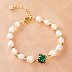 They are very beautiful and shimmer in the sun. True feet and four-leaf clover are very rare, which makes them unique and extremely valuable to those who are lucky enough to find them.Keep this beautiful bracelet close at hand and invite your luck, love and love into your daily life.

Natural green agate, freshwater pearl
Pearl diameter: 6 mm
Elastic - Suitable for hand circumference: 14-19 CM
Handmade with love 
Hypoallergenic, lead & nickel free 

If you aren't in LOVE with your purchase, plea