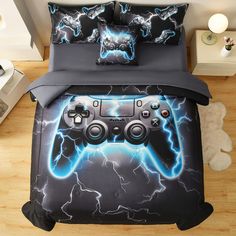 a bed with a video game controller printed on the comforter and pillow cases, along with matching pillows