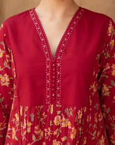 RUDHIRA - New Arrivals! Comfortable and flattering, this lively floral print is striking with a touch of artistry. Delicate hand embroidery at the neckline and matching fabric ghundis enhance its traditional appeal. [ Cottons Jaipur, Cotton, Kurta, Dress, New Arrivals] #cottons #cottonsjaipur #newarrivals #newcollection #everyday #essentials #dailyfits #comfort #cottonkurtas #breathablefabric #kurta #handcrated #red #sage #solid #monochrome #cottonsuits #daywear #shoponline #shopnow Cottons Jaipur, Red Sage, Churidar Designs, Salwar Designs, Long Kurti, Kurti Designs Latest, Long Kurti Designs