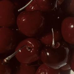 a close up view of cherries in a bowl