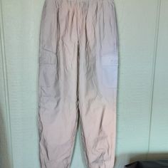 Forever 21 Women's Twill Cargo Joggers Size S,Silver, Lined Windbreaker Pants Nwt, Featuring An Elasticized Drawstring Waist, Side And Front Flap Pockets, Cuffed Hem And Baggy Fit, 100%Polyester. Made In China. 497. Forever 21 Bottoms With Pockets For Spring, Forever 21 Sporty Bottoms For Spring, Sporty Spring Bottoms From Forever 21, Casual Forever 21 Bottoms With Cargo Pockets, Forever 21 Trousers With Pockets, Forever 21 High Waist Bottoms With Pockets, Forever 21 High-waisted Bottoms With Pockets, Forever 21 Casual Streetwear Bottoms, Forever 21 Cargo Pants With Pockets For Spring