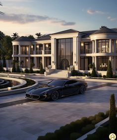 a black sports car parked in front of a large mansion at dusk with palm trees