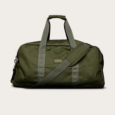 Every bag goes through trial by travel and the Canyon Duffle Bag is one to take the inevitable bumps, tosses, and splashes in stride. Made with water-resistant, tough 100% Cordura™ nylon with a camo-lined interior, military-grade nylon webbing straps and handles, a detachable shoulder strap with removable padded shoulder guard, UCAN zippers, and pockets aplenty — it’s the complete package for off the beaten path and business travel alike. | Tecovas Men's Canyon Duffle Bag, Moss, Nylon Shoulder Guard, Roper Boots, Off The Beaten Path, Military Grade, Shoes Booties, Leather Care, Tall Boots, Cowgirl Boots, Business Travel